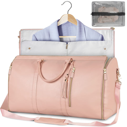 Pink duffel bag with clothes and a clear pouch on a white background